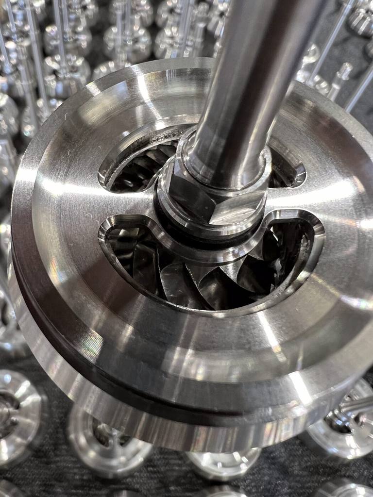 Machined stainless burr and drive, close up